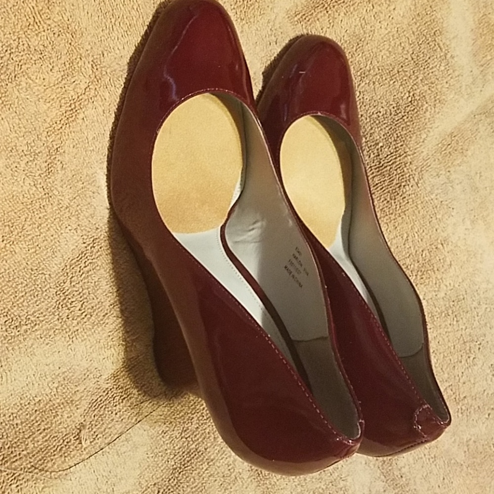 Used Calvin Klein wedged heels with round toe. Wor